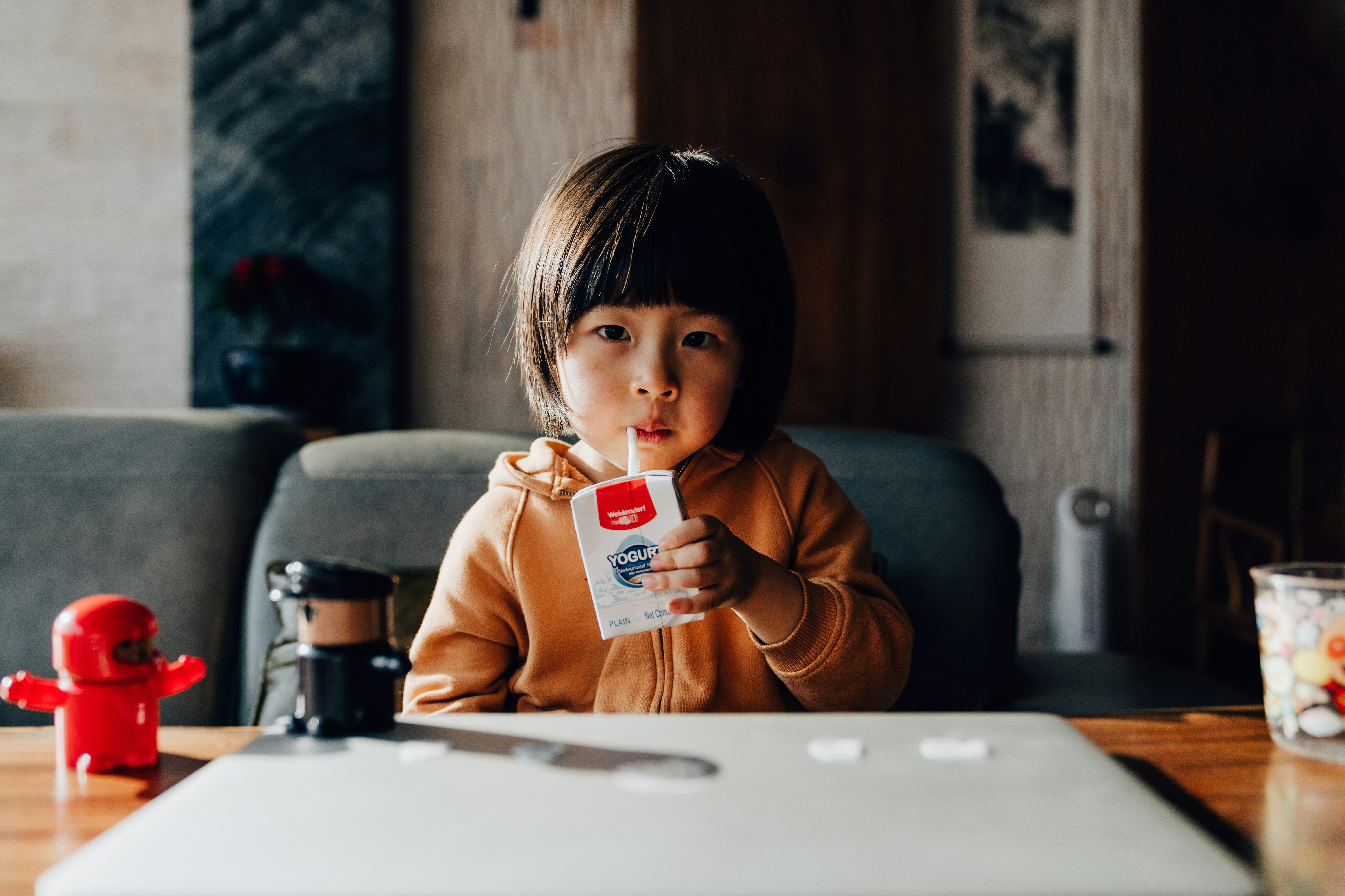 Toddler drinking milk with healthy meal